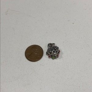 Filigree heart pendant with white opaque stone.